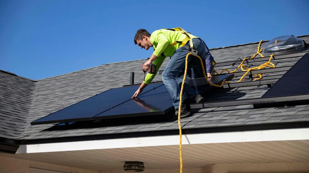 Solar panel installation integrated with residential roofing system