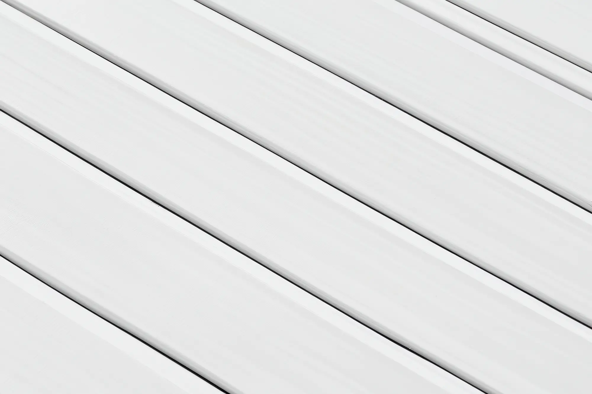 Smooth white vinyl siding planks