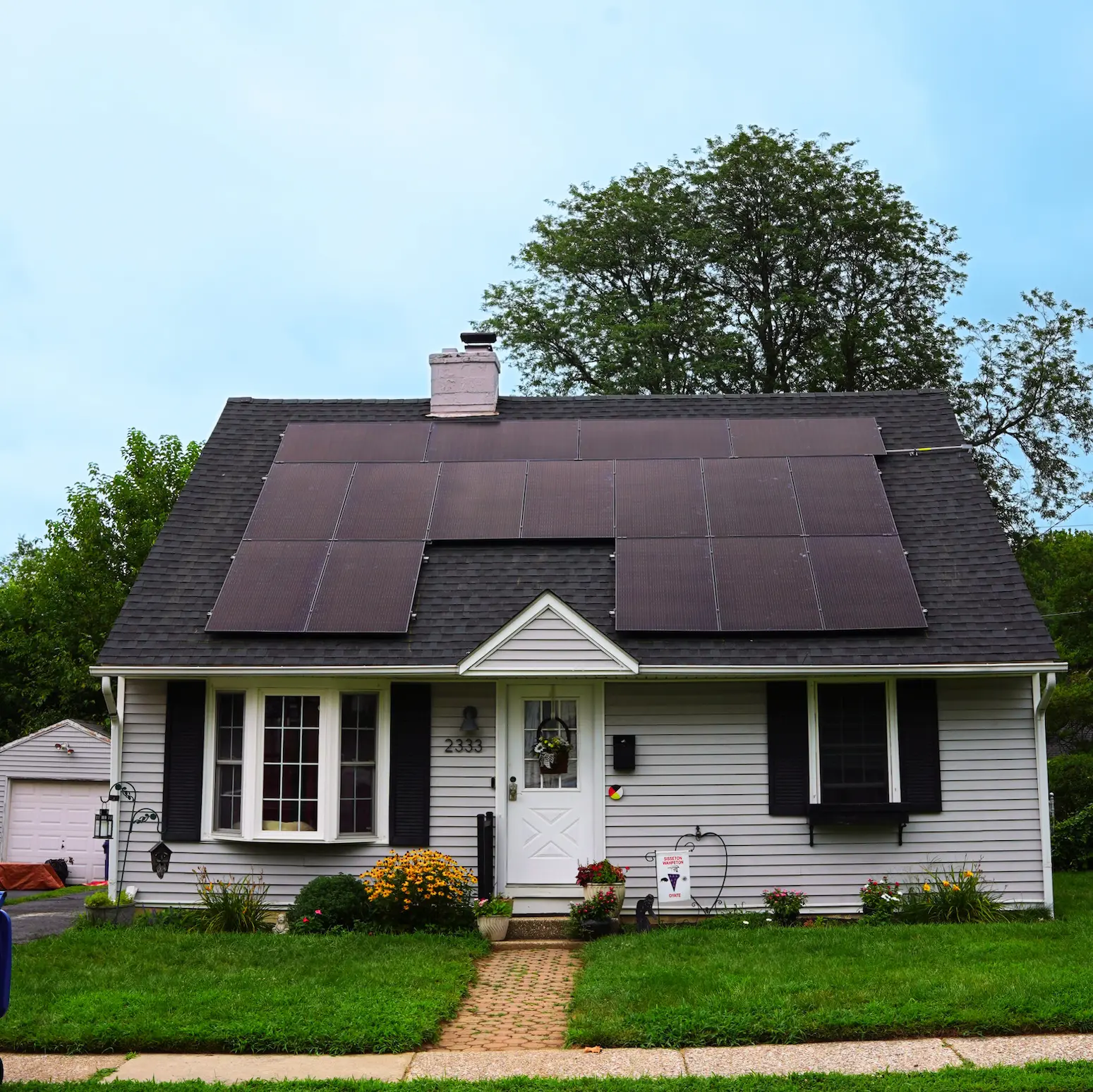 residential home with solar on roof all black panels