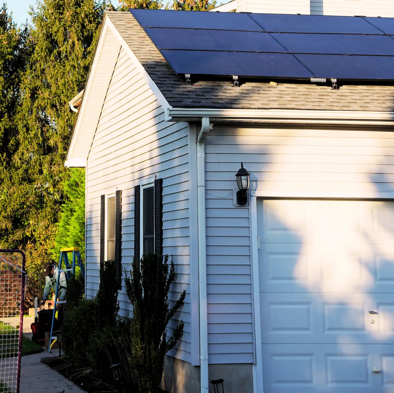 Home with clean white siding and rooftop solar