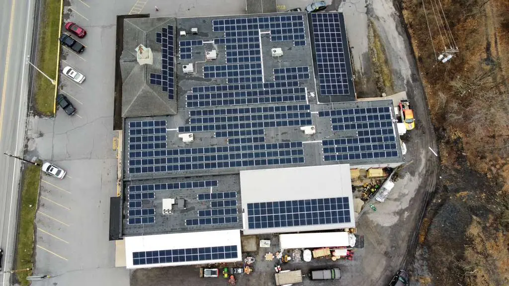 Commercial complex with full rooftop solar coverage